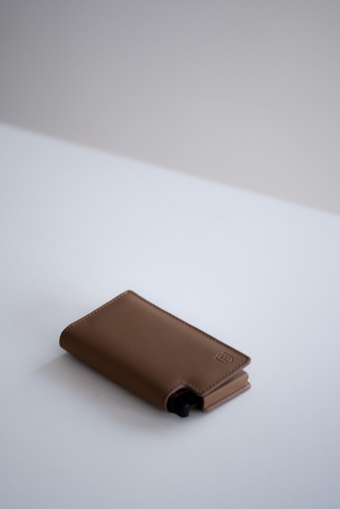 close up of ekster wallet mechanism