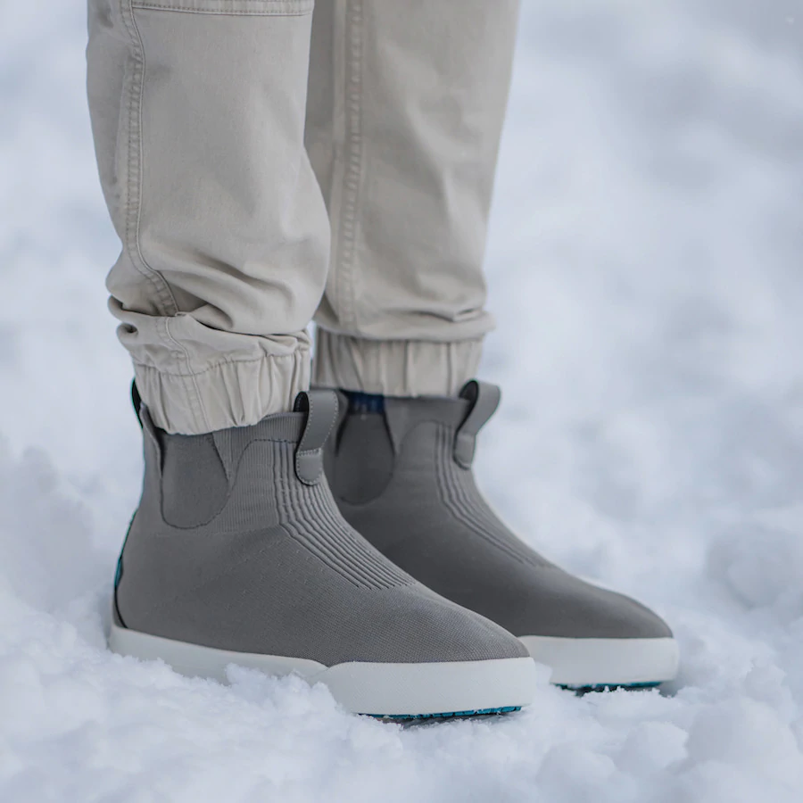 person wearing grey vessi weekend chelsea shoes in show