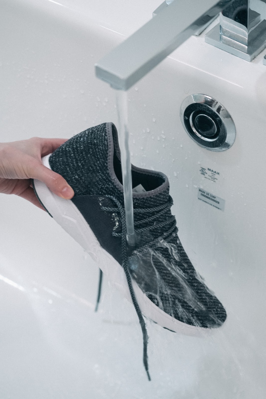 Alessi shoe being washed underwater 