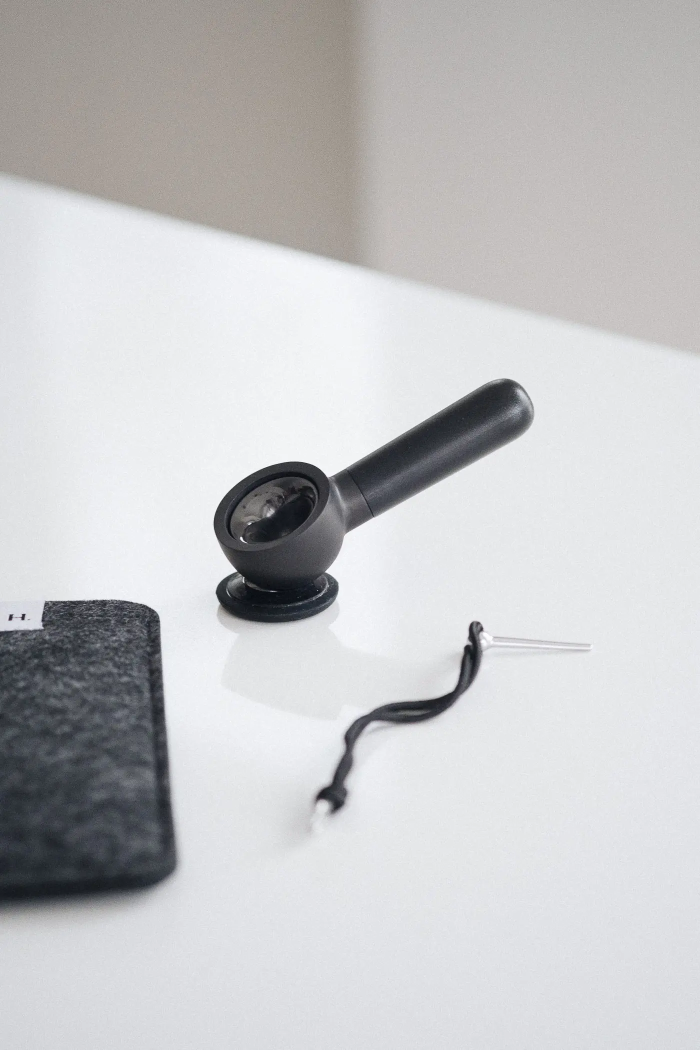 heir handpipe sitting on stand on table