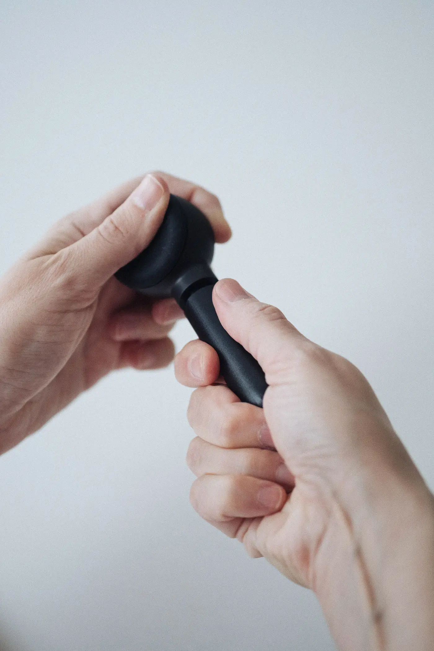 woman unscrewing handpipe