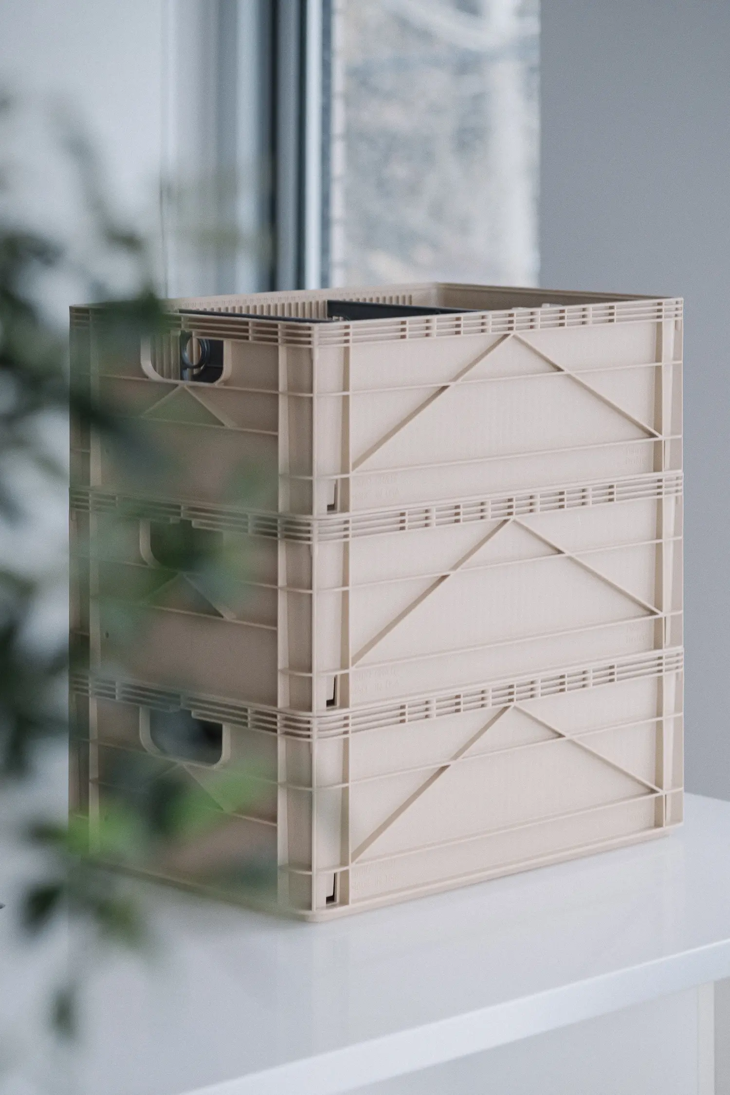 3 tan colored sidio crates stacked on each other